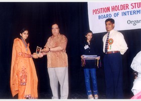 Atta-ul-Haq Qasmi presented Gold Medal & Shield to Quratul-Ain. (2003)