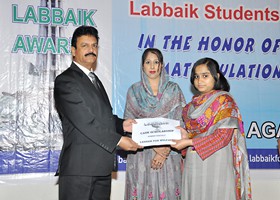
Nisar Zia Chairman LFW presented Cash Scholarship to Amina Siddique (2013)