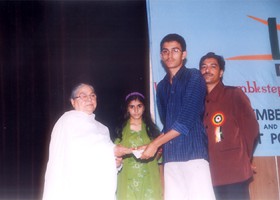 
Sr. Headmistress Creseant School presented Cash Scholorshp to Mirza Muhammad Ali. (2004)